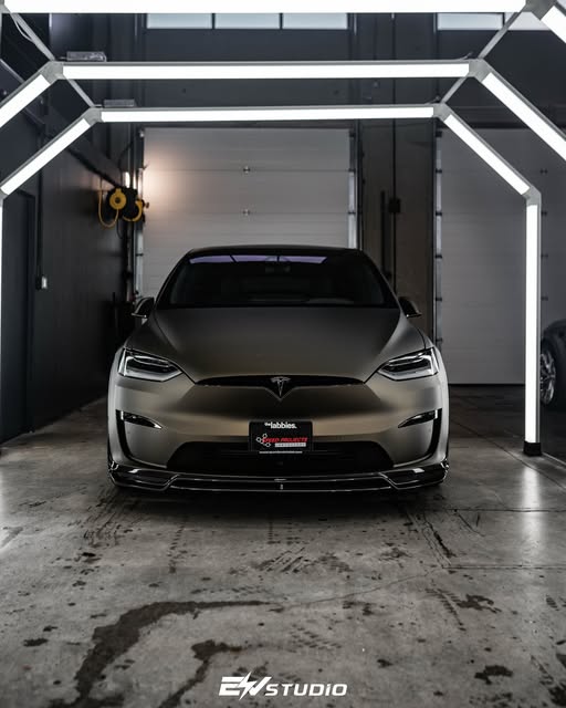 Satin-finish Tesla Model X with a front lip